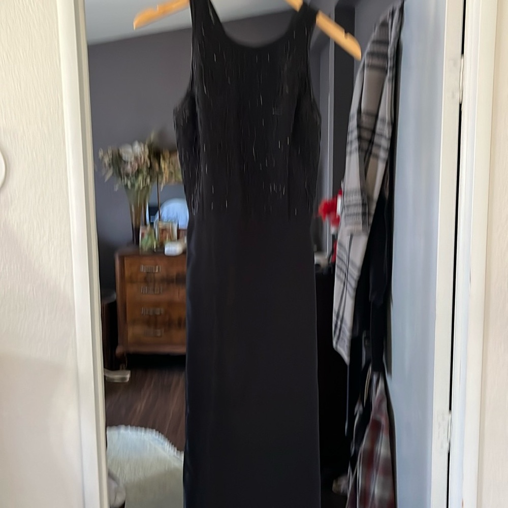 Jessica McClintock dress size 6 the material is super shiny with a beaded top